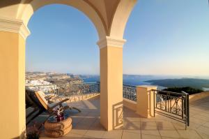 a balcony with a view of the ocean at Archipel Mansion in Fira