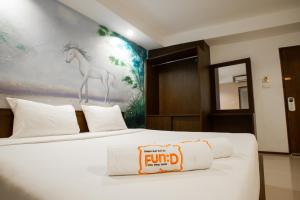 Fun-D City View SHA Plus客房内的一张或多张床位
