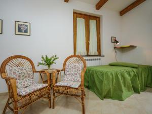 a room with a table and two chairs and a bed at Boutique Mansion in Sorrento with Picturesque View in Sorrento