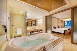 Voodi või voodid majutusasutuse Hotel Okura Macau toas