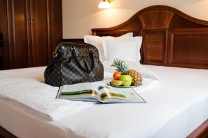 Posteľ alebo postele v izbe v ubytovaní Hotel Dorottya