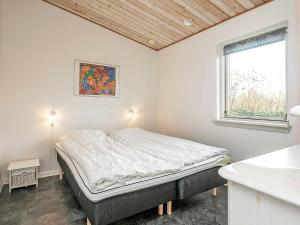 Postel nebo postele na pokoji v ubytování Holiday Home Helmklit II