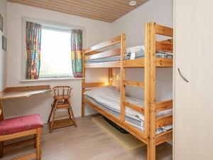 Postel nebo postele na pokoji v ubytování Holiday Home Helmklit II