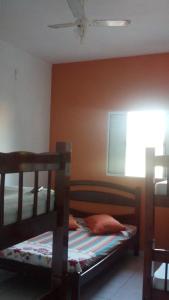 Katil atau katil-katil dalam bilik di Pousada Iguape Apartamentos - Unidade Ilha Comprida