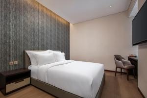 Voodi või voodid majutusasutuse The Five Residences Hanoi toas