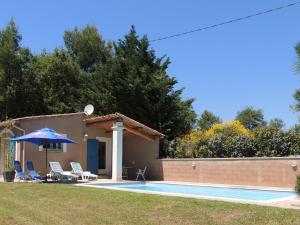 a villa with a swimming pool and a house at Holiday Home in Buisson with Private Pool in Buisson