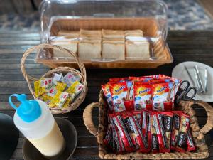 a picnic table with snacks and a bottle of milk at The Seacret Kohlarn in Ko Larn