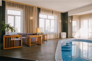 a hotel room with a swimming pool at Otte in Myrhorod