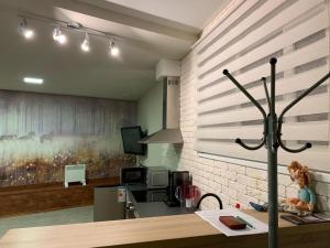 a room with a counter and a wall at Harland apartments in Petrozavodsk