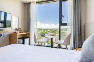 Postel nebo postele na pokoji v ubytování Shin Shin Hotel Cheonjiyeon