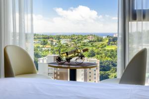 Postel nebo postele na pokoji v ubytování Shin Shin Hotel Cheonjiyeon