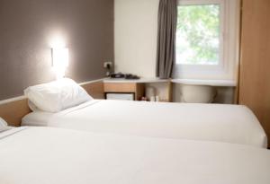 Postel nebo postele na pokoji v ubytování ibis Newcastle