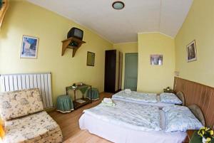 Postel nebo postele na pokoji v ubytování Muskátli Panzió