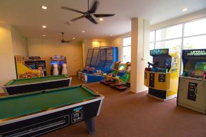 a room with a pool table and arcade games at Taman Air Lagoon Resort at A921, unlimited waterpark access, Melaka in Malacca