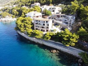 an aerial view of a building next to the water at Punta Rata apartment in Brela