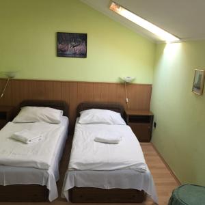 Postel nebo postele na pokoji v ubytování Muskátli Panzió