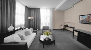Postel nebo postele na pokoji v ubytování Focus Hotel Premium Elbląg + 37 fotografií