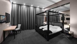 Postel nebo postele na pokoji v ubytování Focus Hotel Premium Elbląg