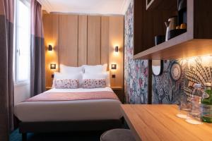 Postel nebo postele na pokoji v ubytování Leonardo Boutique Hotel Paris Opera