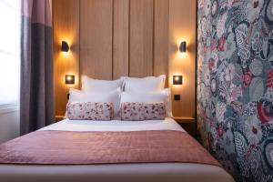 Postel nebo postele na pokoji v ubytování Leonardo Boutique Hotel Paris Opera