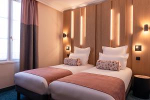 Postel nebo postele na pokoji v ubytování Leonardo Boutique Hotel Paris Opera