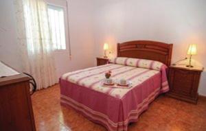 En eller flere senge i et værelse på Casa Rural Torrox - Cortijo Latero