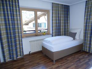 Postel nebo postele na pokoji v ubytování Appartementhaus Mayrhofen by PiaundDirk
