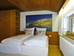 Postel nebo postele na pokoji v ubytování Appartementhaus Mayrhofen by PiaundDirk