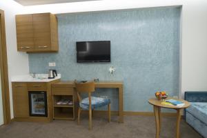 Kuchyň nebo kuchyňský kout v ubytování Cumbali Suite Hotel