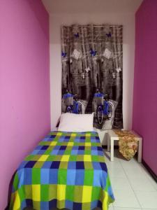 En eller flere senger på et rom på CAMELIA HOLIDAY APARTMENT