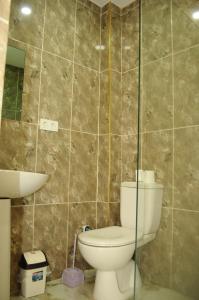 a bathroom with a toilet and a sink at Kemer Suites in Kemer