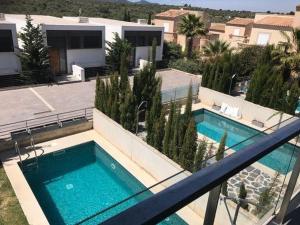 an image of a swimming pool on a house at Luxus-Chalet-Casas-Blancas-cases-blanques-1-casa-A in Cala Mendia