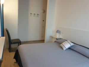Łóżko lub łóżka w pokoju w obiekcie Il Rifugio Del Tempo