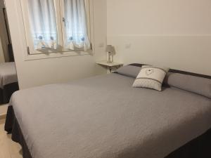 Łóżko lub łóżka w pokoju w obiekcie Il Rifugio Del Tempo