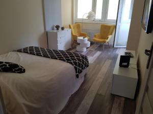 Posteľ alebo postele v izbe v ubytovaní Dmuchawiec + 2 fotografie