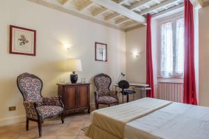 Posteľ alebo postele v izbe v ubytovaní Fontanella Borghese Apartment - FromHometoRome