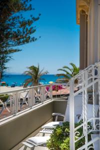 a balcony with a view of the beach at Hotel La Villa Del Mare in Cagliari