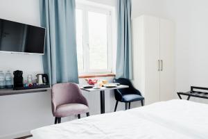Una cama o camas en una habitación de Müllner Smart Hotel Wien Self Check In