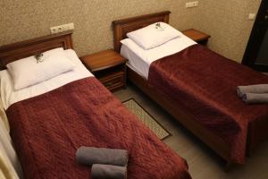 Postel nebo postele na pokoji v ubytování Bogdanov Yar Hotel