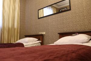 Postel nebo postele na pokoji v ubytování Bogdanov Yar Hotel