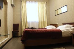 Postel nebo postele na pokoji v ubytování Bogdanov Yar Hotel
