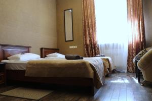 Postel nebo postele na pokoji v ubytování Bogdanov Yar Hotel