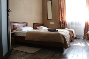 Postel nebo postele na pokoji v ubytování Bogdanov Yar Hotel
