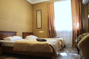 Postel nebo postele na pokoji v ubytování Bogdanov Yar Hotel