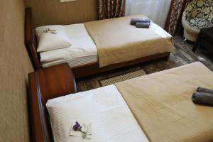 Postel nebo postele na pokoji v ubytování Bogdanov Yar Hotel