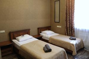 Postel nebo postele na pokoji v ubytování Bogdanov Yar Hotel