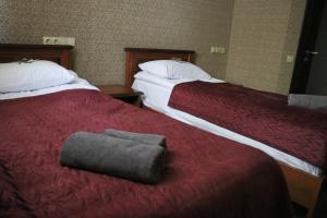 Postel nebo postele na pokoji v ubytování Bogdanov Yar Hotel