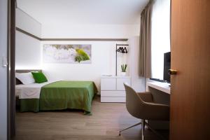 Posteľ alebo postele v izbe v ubytovaní Bonotto Hotel Palladio