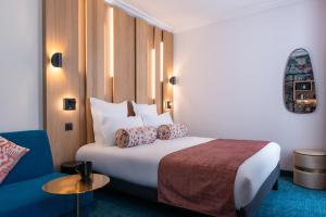 Postel nebo postele na pokoji v ubytování Leonardo Boutique Hotel Paris Opera