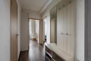 a bathroom with a sink and a mirror at Salut Plus Apartments in Saint Petersburg